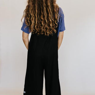 Wings Hawaii model wearing Sun Pocket Overalls in Black