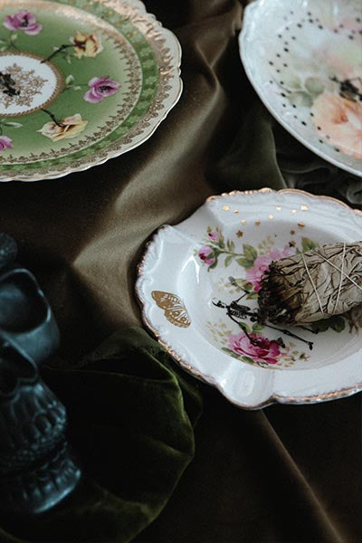 Wings Hawaii vintage upcycled ashtray with skeleton, butterfly, and florals