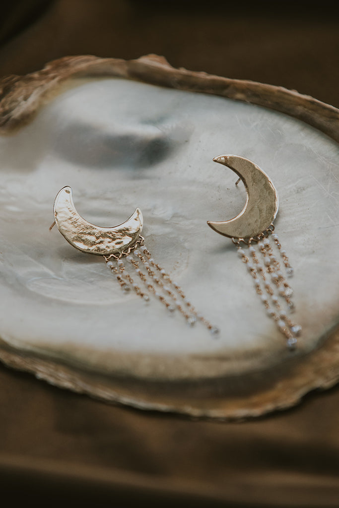 14K Yellow Gold Carved moon studs with diamonds and baroque pearls hanging from them