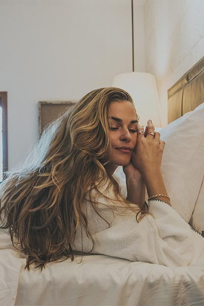 Model wearing Wings Hawaii Chain Reaction Bracelet in gold fill