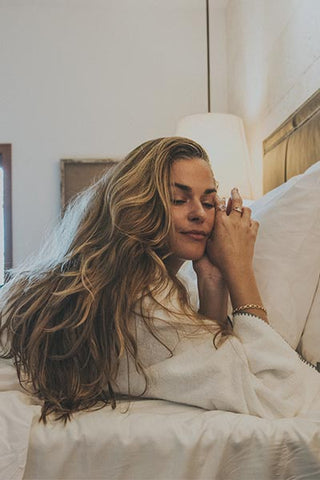 Model wearing Wings Hawaii Chain Reaction Bracelet in gold fill