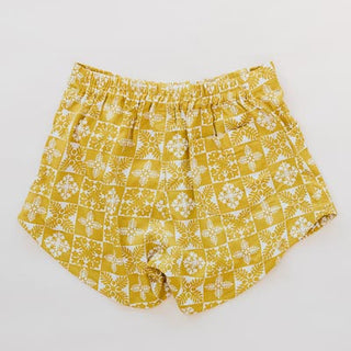 Wings Hawaii retro pocket shorts in quilted ulu and plumeria print in marigold - back