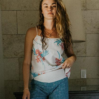 Wings Hawaii model waering Orchid Breeze Trapeze Tank and pau hana pants