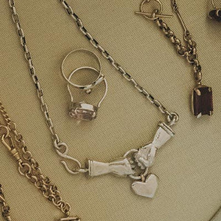 Wings Hawaii Stolen Heart Necklace in sterling silver, shown with others