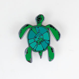enameled pin of a green sea turtle