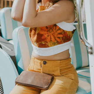 Model wearing Wings Hawaii retro pocket pants in marigold corduroy
