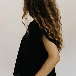 Wings Hawaii model wearing Classic Black Boxy Button-up