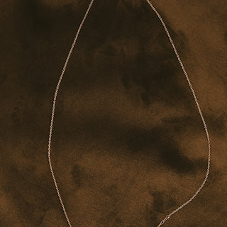 A delicate chain necklace with 9 raw diamonds 