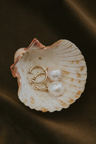 Large baroque freshwater pearls set on 14K yellow gold closing hoop earrings