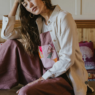 Button down blouse in bone color with sun moon collage patch on the back