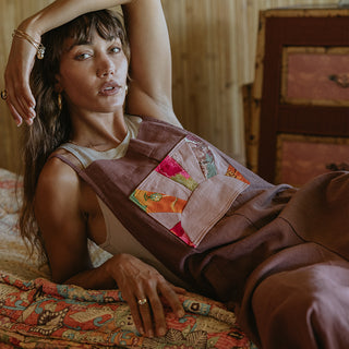 Linen rose colored wide leg overalls with collage sun patch as front pocket
