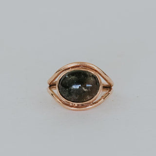 A Tourmaline set in 14K Yellow Gold int he shape of an evil eye