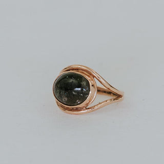 A Tourmaline set in 14K Yellow Gold int he shape of an evil eye