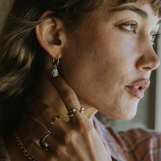 tear drop sunstone prong set and attached to clasping hoop earrings 14K