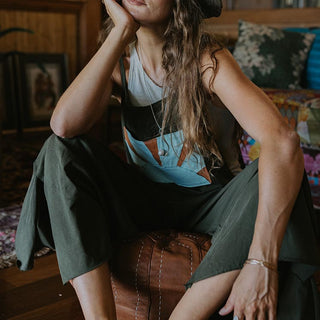 Cotton Overalls in forrest green color with a Sunrise patch as a pocket