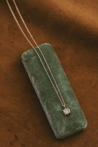 Rose cut sunstone prong set in 14K yellow gold 