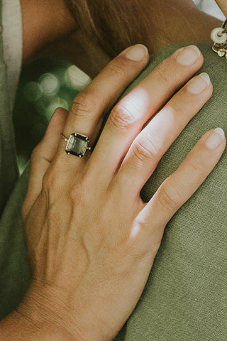 A Square Cut Tourmaline Prong Set in a 14K yellow gold ring