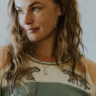 Wings Hawaii model wearing the vintage tiger sweater