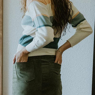 Wings Hawaii model wearing the vintage tiger sweatshirt and corduroy skirt