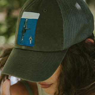 trucker cap with what and diver embroidered patch