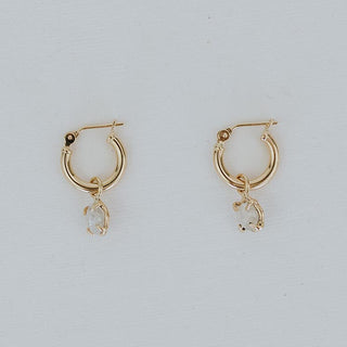 raw diamonds prong set and dangling from clasping hoop 14K Yellow Gold