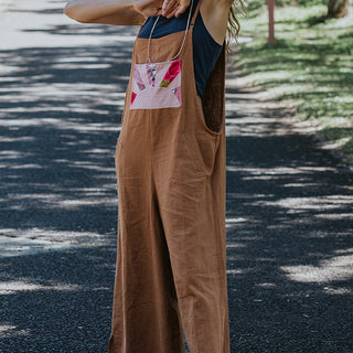 Clay colored linen wide leg overalls with pink sun collage patch as front pocket 