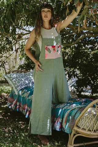 Linen sage colored wide leg overalls with pink sun collage patch as front pocket