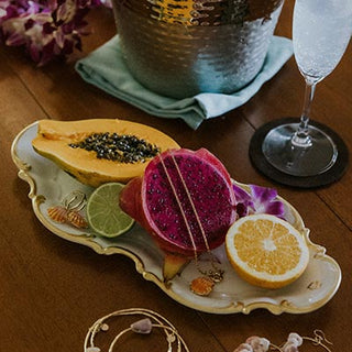 Tablescape with Reclining Mermaid Jewelry Tray and various Wings Hawaii jewelry