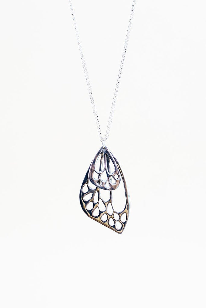 small and large butterfly wing made of sterling silver hanging on silver chain necklace