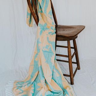 turkish towel blanket with teal and yellow banana patch print