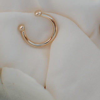 A Womens ring in the shape of a horse shoe