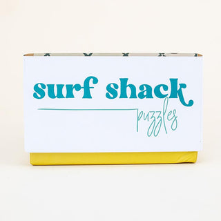 surf shack puzzle A super fun puzzle made of premium 100% recycled Eska board. Printed with non-toxic inks and a matte finish. Art by illustrator Kim Sielbeck based in Hawai'i. 